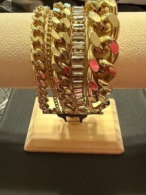 Gold tone with latch closing 5 strand bracelets attached . Unique New